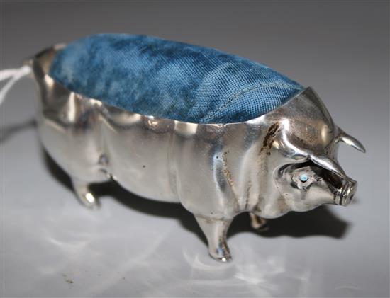 An Edwardian large silver pin cushion modelled as a pig by Levi & Salaman, Birmingham 1904, length 4.25in.
